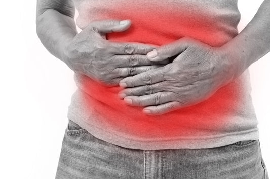 heartburn patient holding stomach