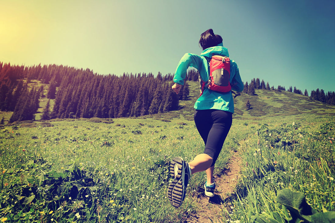 woman on muscle detox running up hill